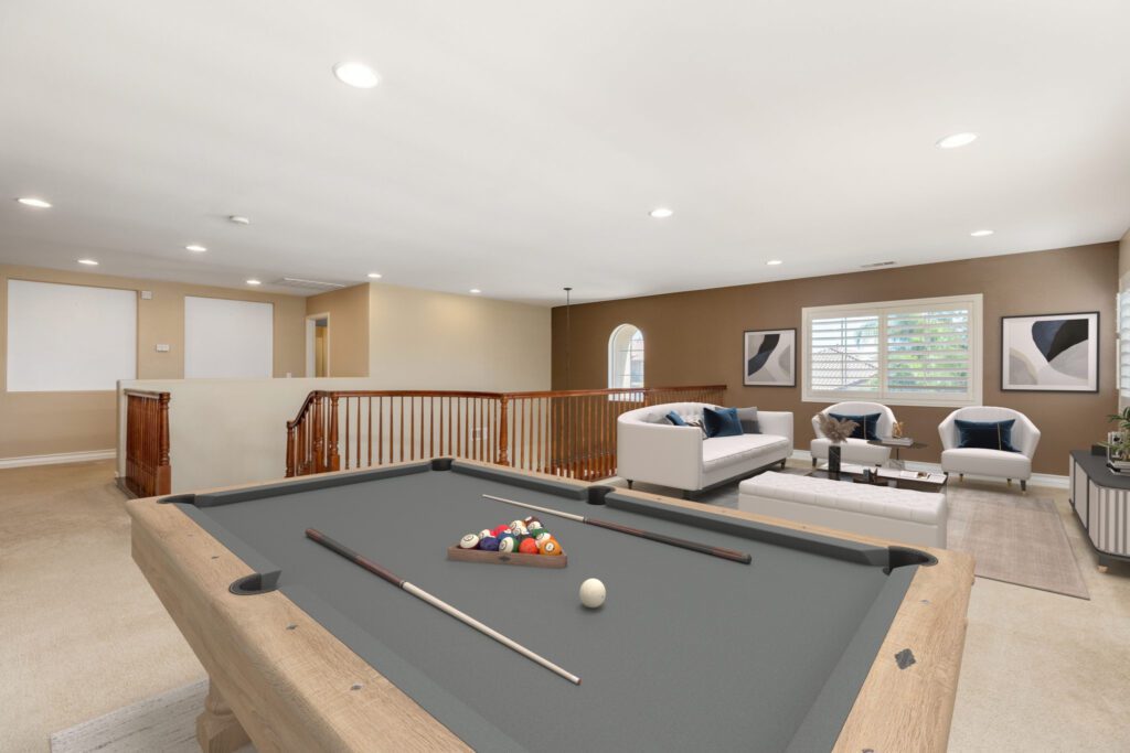 Stylish game room featuring a pool table, inviting seating area, and modern decor, ideal for relaxation and entertainment.